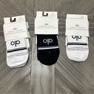 ALO Yoga Unisex Half-Crew Socks - Black and White.